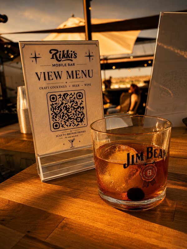 Rikki's Mobile Bar cocktail with QR tip sign